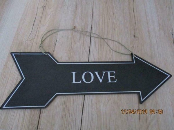 bordje met opschrift richting de liefde